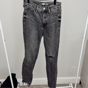 Super skinny black jeans with a small rip